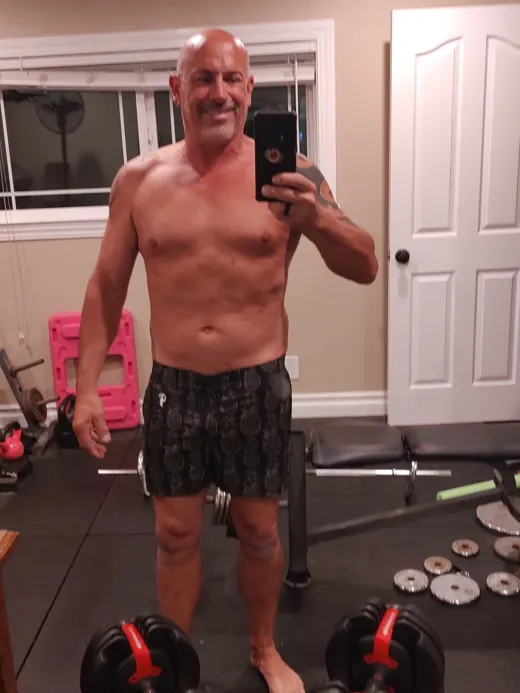 Customer photo from Mike G. wearing Golden Pineapple Black Swim Shorts - 3"
