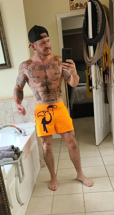 Customer photo from Yancey N. wearing Fluro Orange Swim Trunks - 3"
