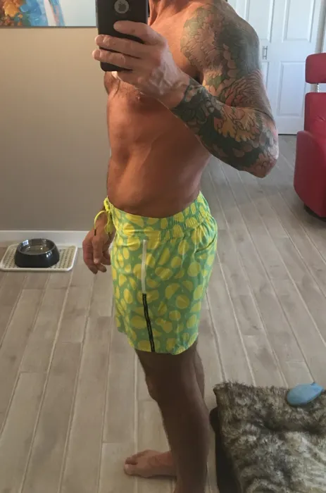 Customer photo from Todd W. review of Drip Series Swim Shorts - Green Drip
