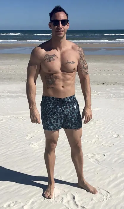 Customer photo from Derek L. review of Electric Hibiscus Black Swim Shorts