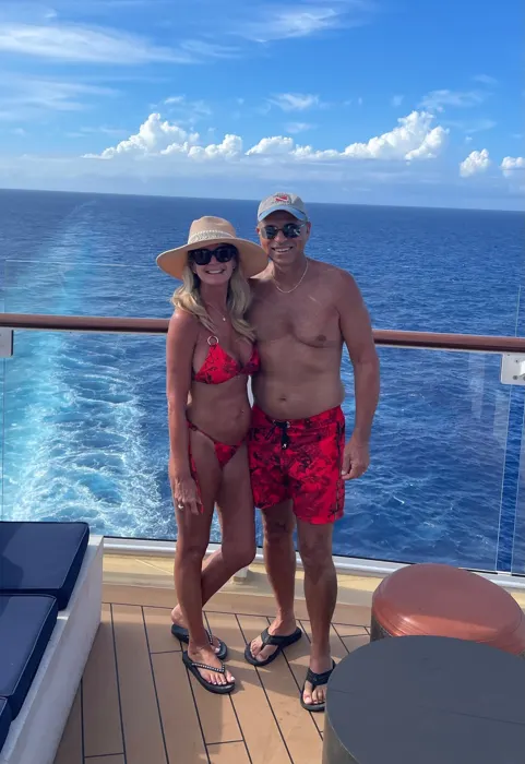 Customer photo from Kelly N. wearing Splatter Swim Shorts Red - 5"